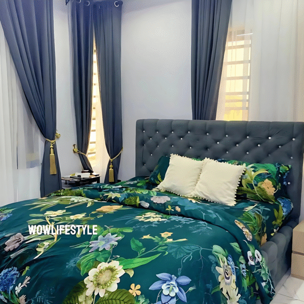 Green flowery polished cotton bedding set on a bed, includes bedsheet, duvet cover, and pillowcases.
