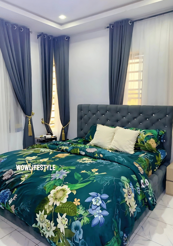 Green flowery polished cotton bedding set on a bed, includes bedsheet, duvet cover, and pillowcases.
